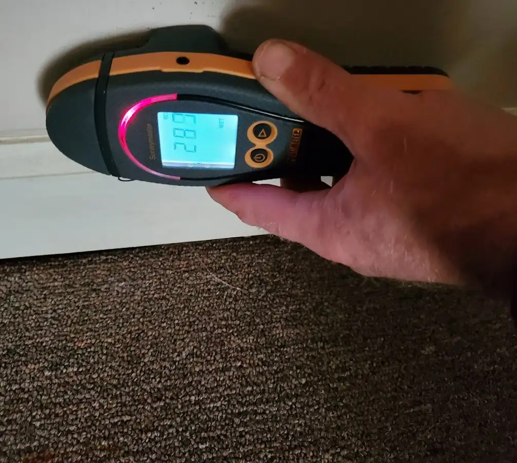 Moisture detection at baseboard during Storm Damage Restoration in La Crescenta-Montrose